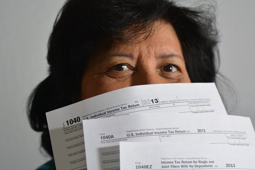 IRS form shown by a woman