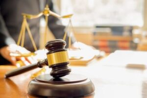 A gavel on a judge table in a law firm.